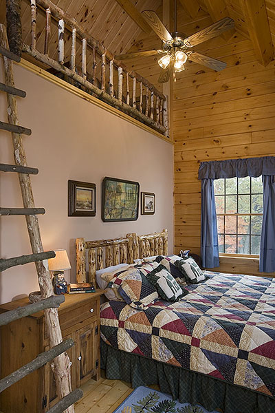 Interior, vertical, upper level guest bedroom with loft, Hofmann residence, Pike, New Hampshire, Coventry Log Homes