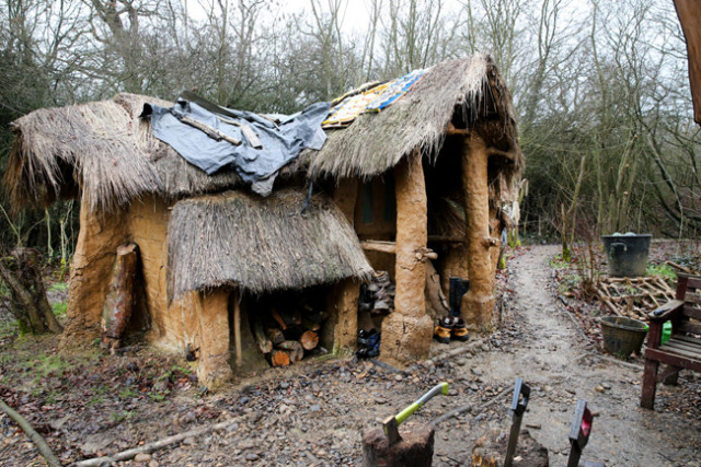 11P10 Mud house in the woods